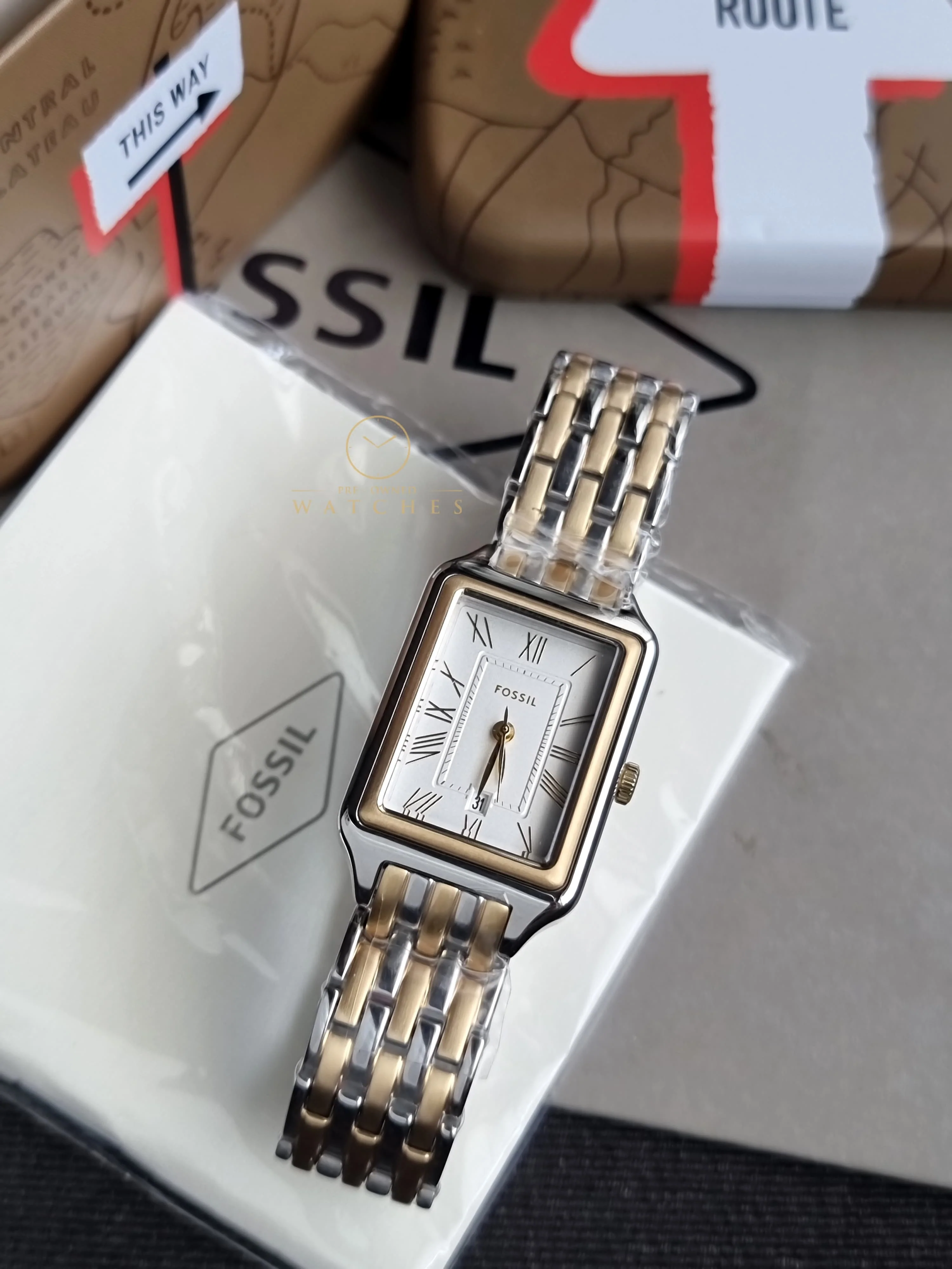 Fossil Women's Raquel Three-Hand Date Silver and Gold Two-Tone Stainless Steel Bracelet Watch (Model: ES5368)